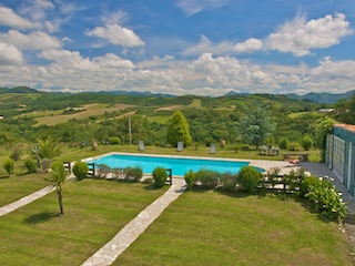 The pool, pool-house, and surrounding Basque Mountains.
